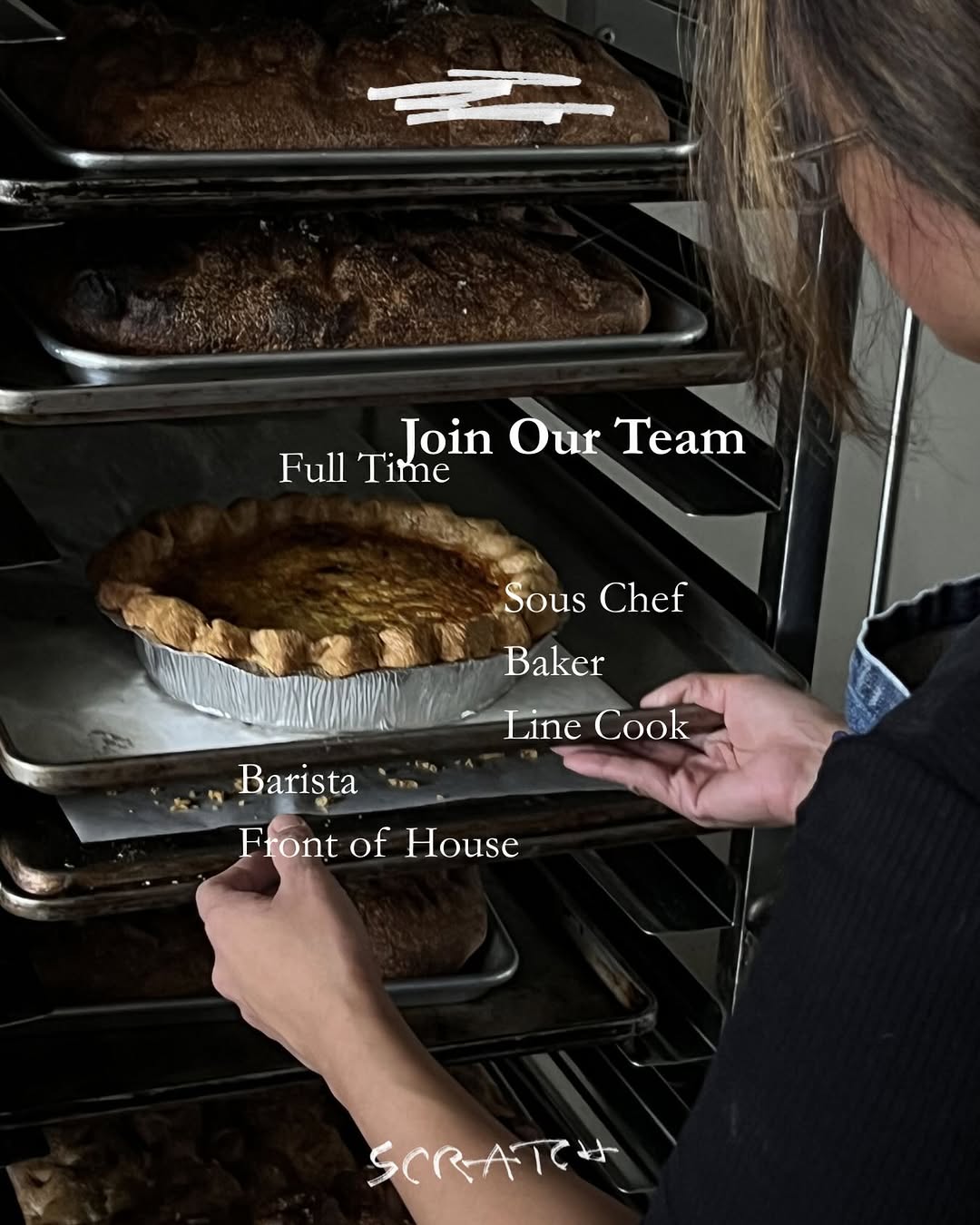 Baker loading bread into oven